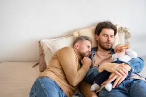 same sex concept of two dads holding their child