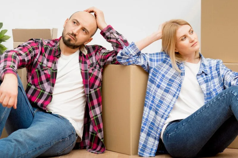 alimony concept of a couple pondering how moving in together might impact alimony