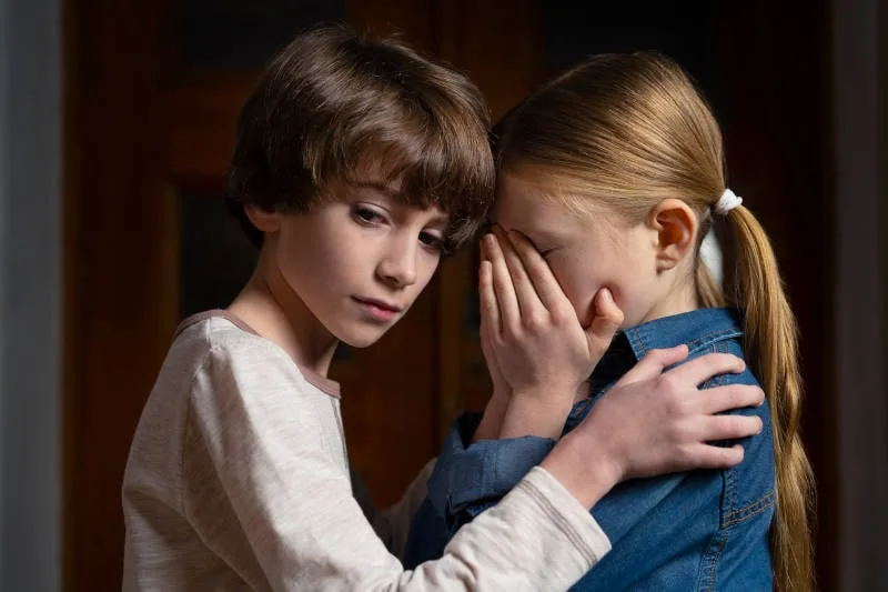 child custody concept of siblings learning they will be separated from parents divorce